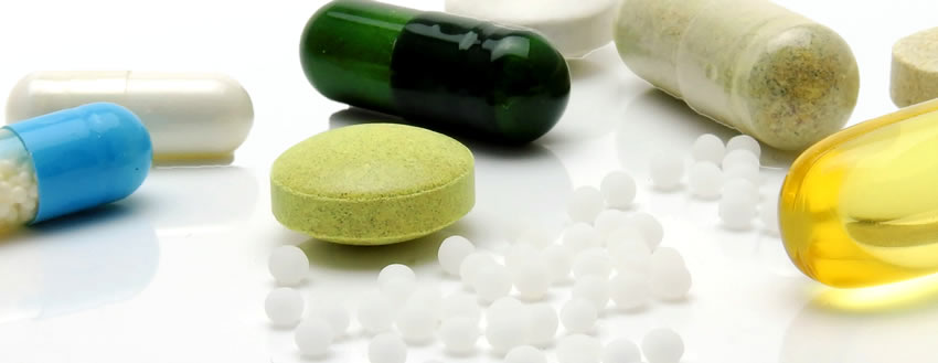 Image of various pills representing repeat prescription services